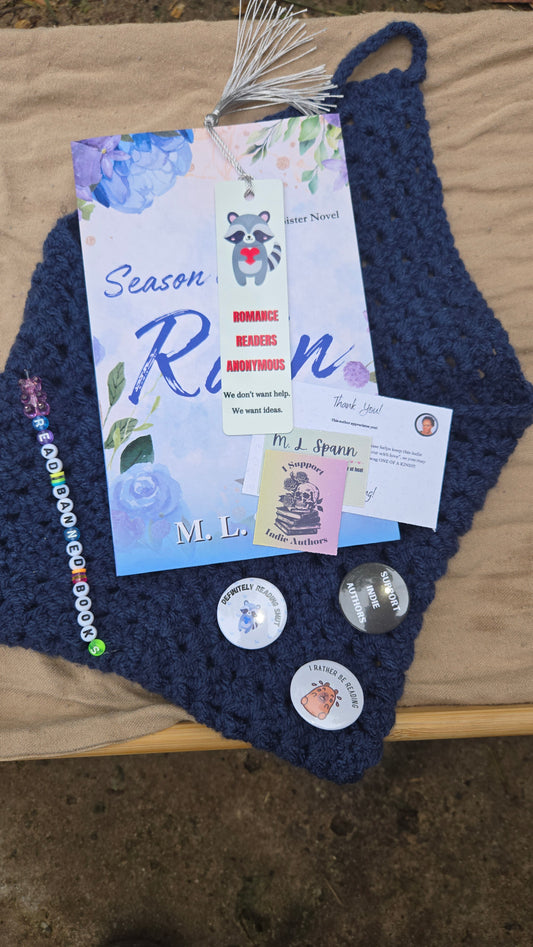 Blue book sleeve, signed book, button pins, beads, stickers, bookmark